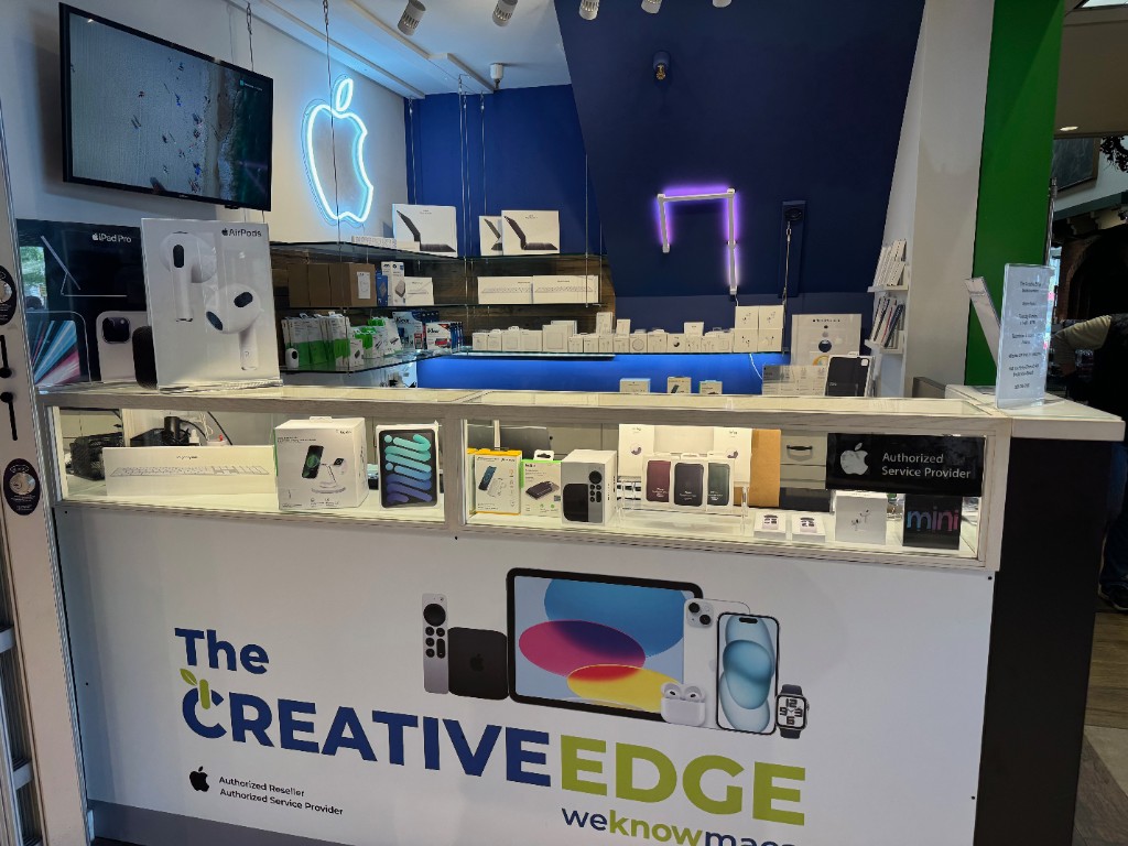 Inside The Creative Edge kiosk at Giacobbi Square — Apple Authorized Reseller and Service Provider counter